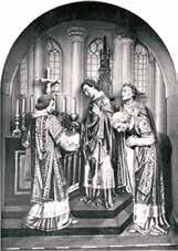 Three priests in ornate robes performing a religious ceremony at an altar.