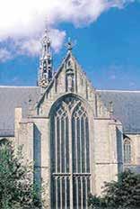 The exterior view of the Church of Saint Lawrence in Alkmaar, showcasing its Gothic architecture.
