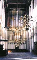 Interior view of the Cathedral of Saint Lawrence with chandeliers and architectural details.