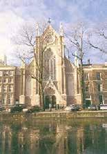 Image of the Gothic-style facade of a church in Amsterdam.