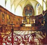Interior of the Chapel of the Holy Blood, featuring ornate wooden paneling and altar linked to the 1405 miracle.