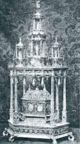 A silver relic containing the Holy Blood of Jesus, ornate with intricate details.