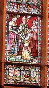 Stained glass window depicting a historical scene with figures in religious attire.