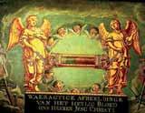 An ornate depiction of angels holding a relic associated with Jesus Christ.
