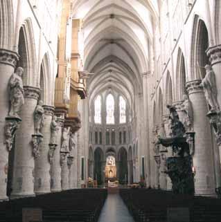 Interior view of the Cathedral of St. Gudula, showcasing its architectural features and seating.