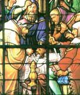 A stained glass window depicting the Eucharistic miracle with figures in historical attire.