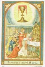 A priest performing a Mass with a chalice, surrounded by children in religious attire.