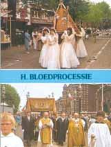 Procession featuring participants in white dresses carrying a religious artifact.