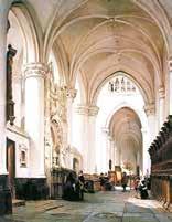 Interior view of a church with high arches and pews.