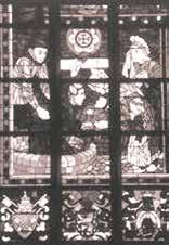 A stained glass depiction of figures involved in the Eucharistic miracle.