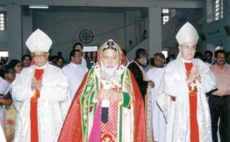 Three clergy members in ceremonial attire at St. Mary's Church, Chirattakonam, during the Eucharistic miracle event of 2001.
