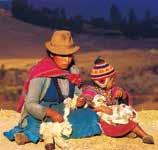 A man and a child sitting on the ground, holding and playing with small animals.