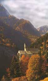 The ancient monastery of St. Georgenberg, nestled in autumnal mountains, where the 1310 Eucharistic miracle occurred.