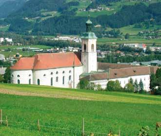 The ancient monastery of St. Georgenberg, nestled in a lush valley, preserves the Precious Blood from the 1310 miracle.