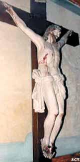 A statue of Jesus Christ on the cross, depicting his crucifixion.