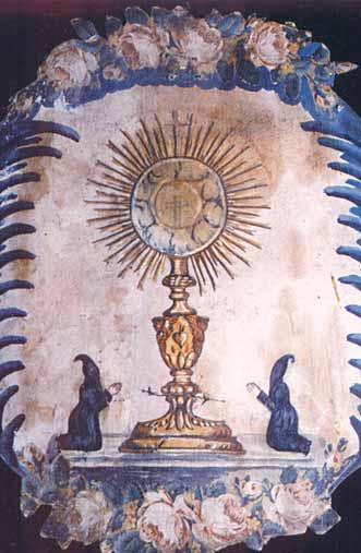 Fresco in the Chapel depicting a radiant monstrance with praying figures, commemorating the 1433 Avignon Eucharistic miracle.