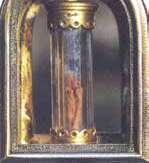 A relic containing a cloth stained with blood, preserved in a crystal tube.