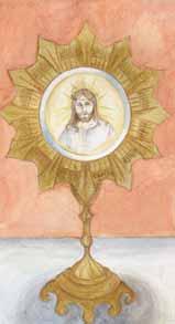 A golden monstrance displaying a depiction of Jesus Christ in the center.