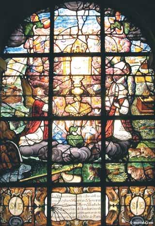 A stained glass window depicting the Eucharist with various figures and scenes.