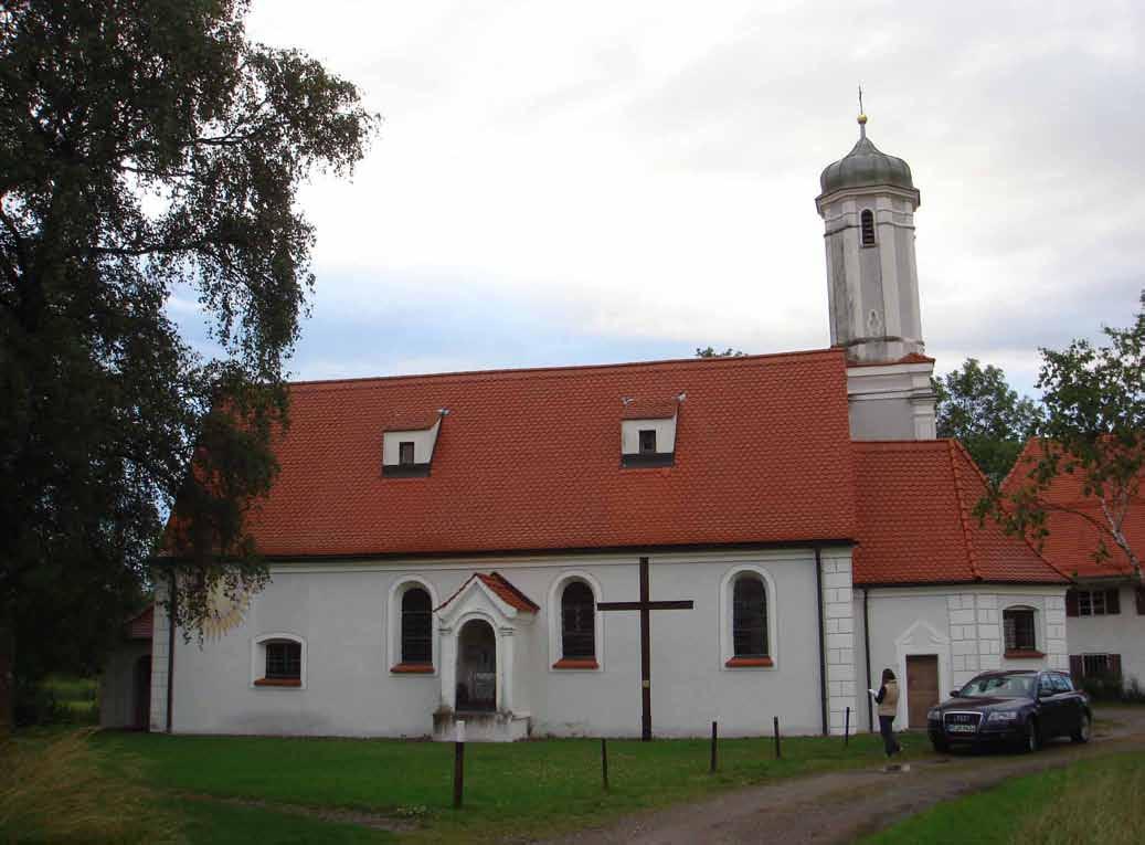 The Church of Benningen, Germany, site of the 1216 Eucharistic miracle revealing hidden malice, features a red roof and bell tower.