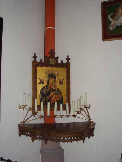 Icon of the Virgin Mary with candles, related to the 1280 Kranenburg Eucharistic miracle, symbolizing divine presence.