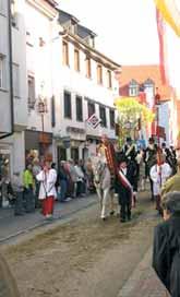 A procession featuring participants in traditional attire celebrating the Holy Blood in Mantua.