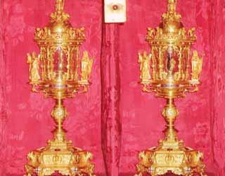 Two ornate golden relics displayed on a red background.