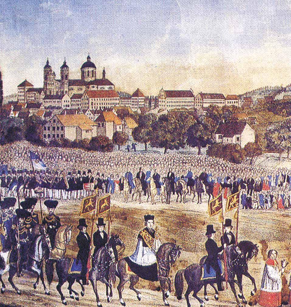 A historical procession with people on horseback and a large crowd in front of a monastery.
