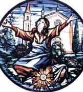 A stained glass depiction of a woman with outstretched arms in front of a church.