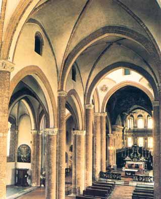 Interior view of the collegiate church of San Secondo, showcasing its architectural features and altar.