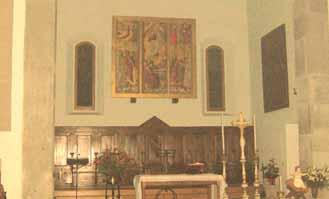 Interior of the basilica where the 1412 Eucharistic miracle occurred, featuring an altar and religious artwork.