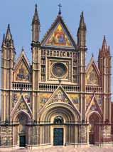 A detailed view of the exterior of the Orvieto Cathedral, showcasing its intricate architecture.