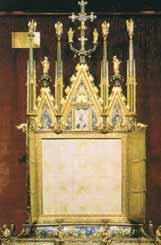 A decorative reliquary with intricate designs and religious symbols, showcasing the Eucharistic miracle.