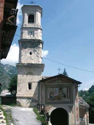 A photo of the Parish Church of Canosio featuring its bell tower and entrance.