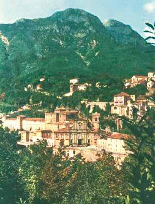 Panoramic view of Cava dei Tirreni, where a 1656 Eucharistic miracle halted a devastating plague, with a mountainous backdrop.