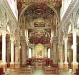 Interior view of the Basilica of Saint Mary in Vado, showcasing its architectural design and altar.