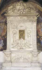 A decorative tabernacle featuring intricate carvings and religious figures.