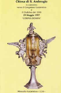 A silver reliquary containing the consecrated Hosts, adorned with angels.