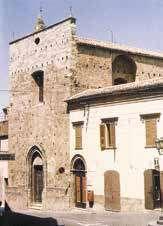 A stone church building with a simple facade and arched entrance.