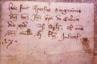 Small parchment from 1356 on which is written: "Here came the flow of Blood of Our Lord Jesus Christ from the chalice on April 25 in the Year of Our Lord 1356"