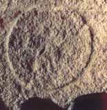 A circular imprint left on the stone floor from the second Host.
