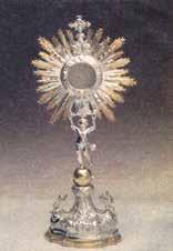 The monstrance of the miracle at Scala, 1732, displaying signs of Christ's Passion during Eucharistic adoration.