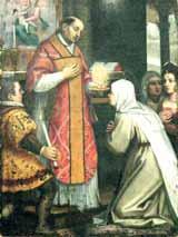 A priest in red vestments administers communion to a kneeling woman, surrounded by onlookers.