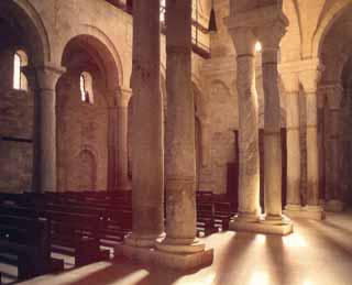 Interior of Trani's cathedral, where the 11th-century Eucharistic miracle relics were historically kept, featuring columns and arches.