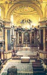 Interior view of a church with ornate architecture and altar.