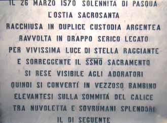 A table documenting the Eucharistic miracle with text detailing the event.