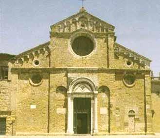 The image shows the exterior of the Church of Saint Francis in Volterra, Italy.