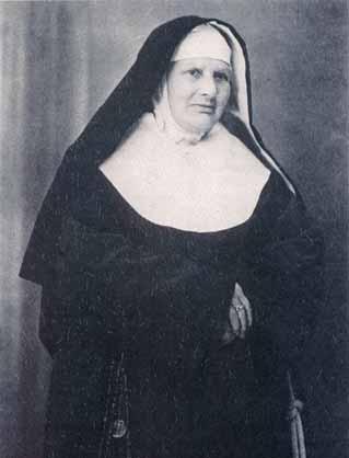 A historical photograph of Sister Maria Minghetti in religious attire.