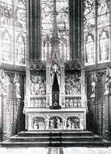 An altar featuring statues and intricate designs, likely related to the Eucharistic miracle.