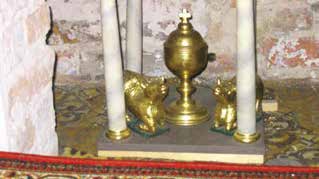 Golden ciborium with kneeling oxen, symbolizing the miraculous adoration of the Host during the Glotowo miracle.